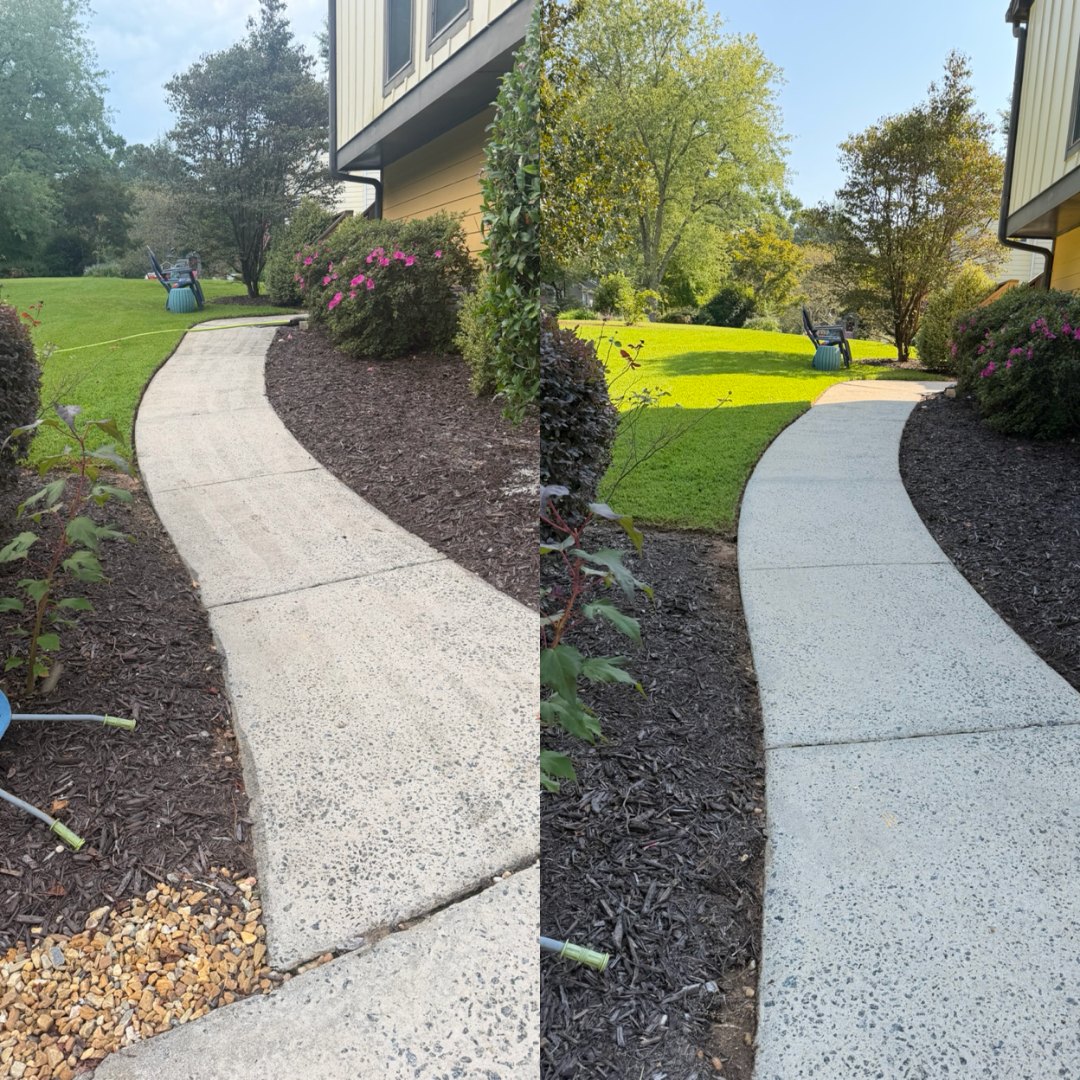 Before and after pressure washing a curved concrete walkway between mulch beds by KM Property Restorations in Marietta